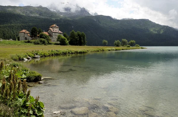 stock image Clear water and castle, engadin