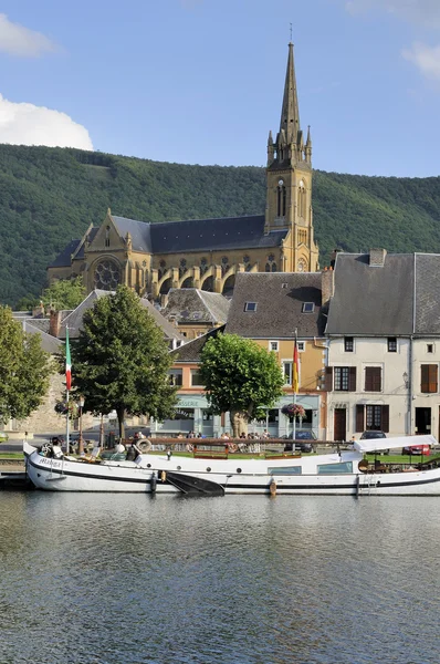 Old boat and church, fumay, ardennes Stock Photo