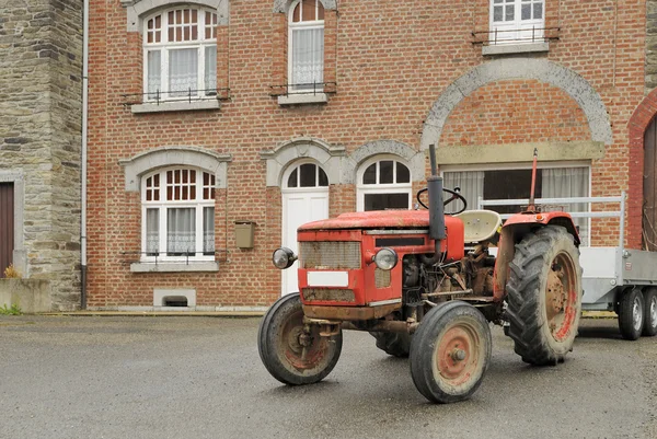 stock image Old tractor and house, ardennes