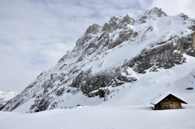 Hut at collac peak in winter, dolomites clipart