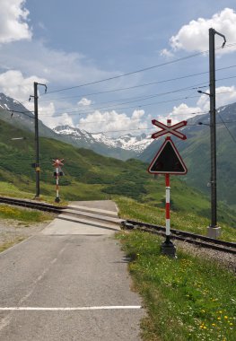 Level crossing, oberalp pass clipart