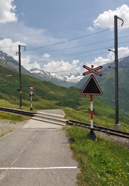 stock image Level crossing, oberalp pass