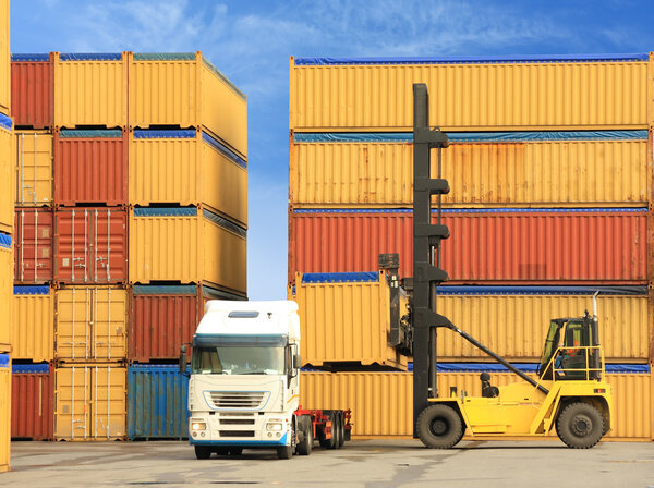 Forklift and truck with shipping containers