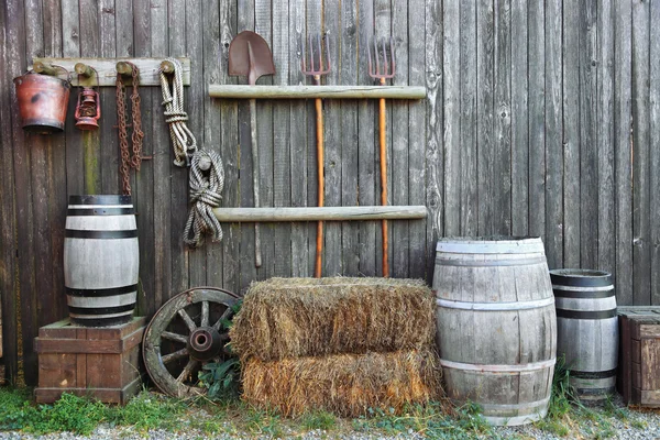 Barrel bale and fork in old barn — Stock Photo, Image