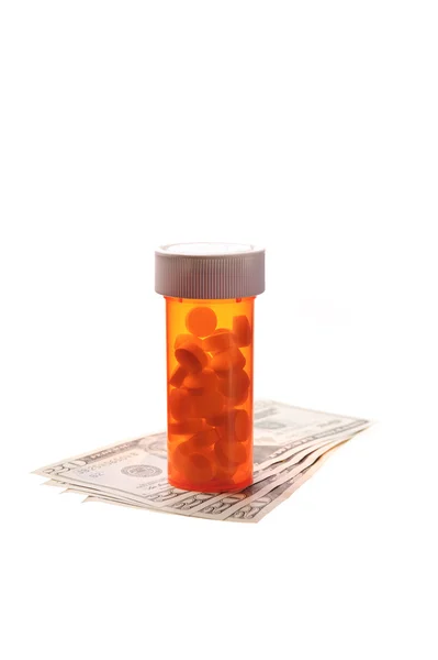 Tabletták és a pénz — Stock Fotó