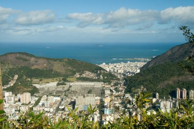 Rio de Janeiro's unique landscape mixing city, mountains, ocean clipart