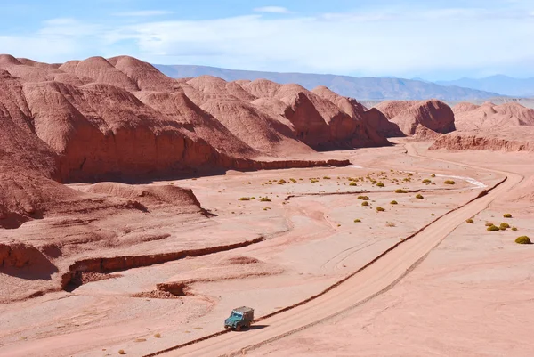 stock image Red Desert Road and Land Rover