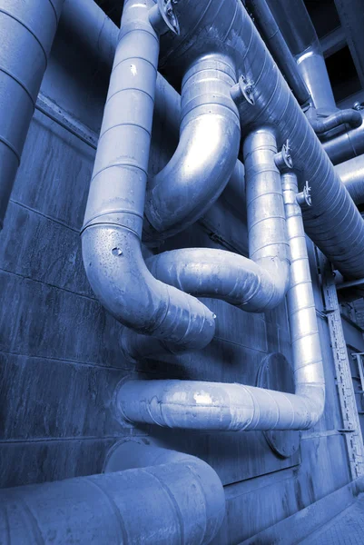 Different size and shaped pipes at a power plant Stock Image