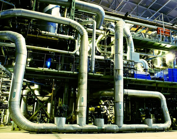 stock image Pipes, tubes, machinery and steam turbine at a power plant