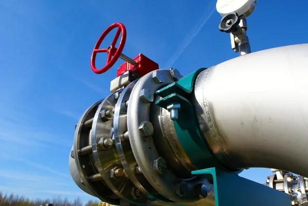 stock image Industrial zone, Steel pipelines and valves against blue sky