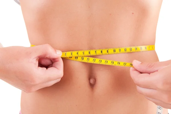 Woman measuring her belly — Stock Photo, Image