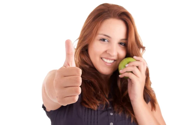 Yeşil elma ve yukarı gösteren başparmak ile genç kadın — Stok fotoğraf