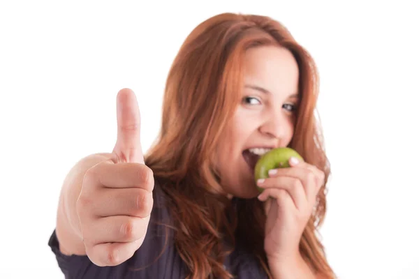 Yeşil elma ve yukarı gösteren başparmak ile genç kadın — Stok fotoğraf