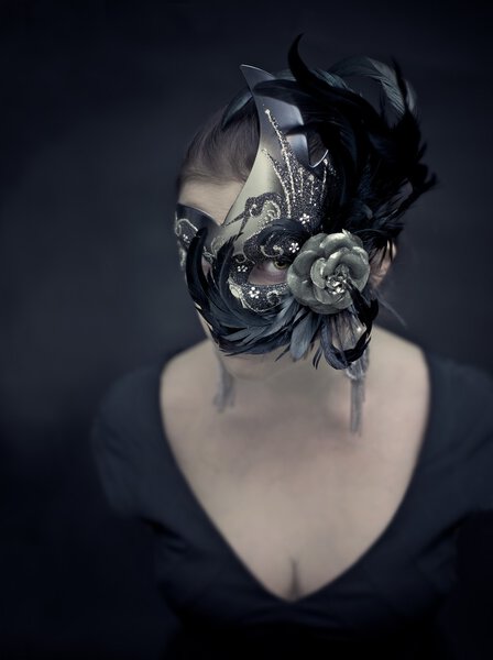 You don't get to see her face. What is this mysterious creature hiding behind this elaborate, Venetian style mask?