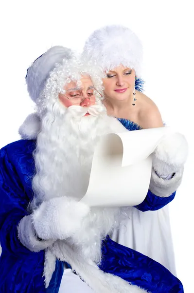 Santa Claus in blue reading list of presents — Stock Photo, Image