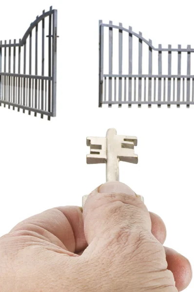 stock image Opening the gate with the key