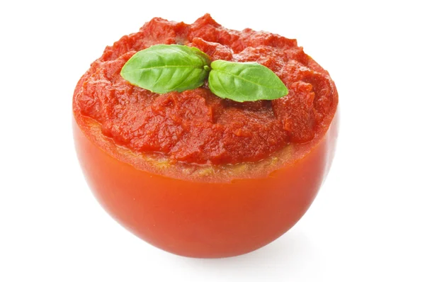 Half Tomato filled with sauce and basil — Stock Photo, Image
