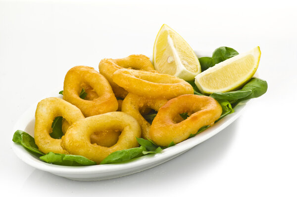 Squid rings on plate with salad