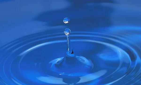 Drop and circles of water — Stock Photo, Image