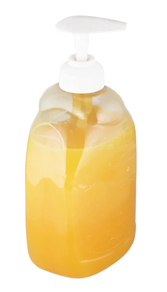 整瓶酒的橙色液体肥皂的手 — 图库照片