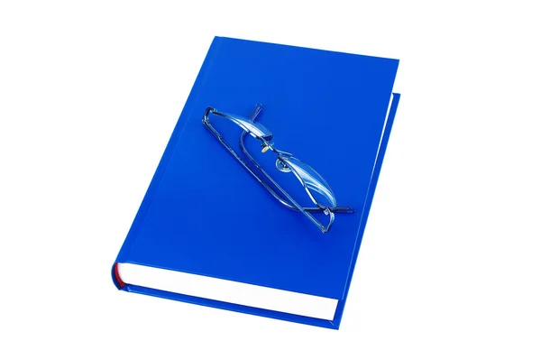 Γυαλιά πάνω από το μπλε βιβλίο — Φωτογραφία Αρχείου