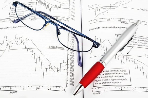 stock image Studying economy with trader book