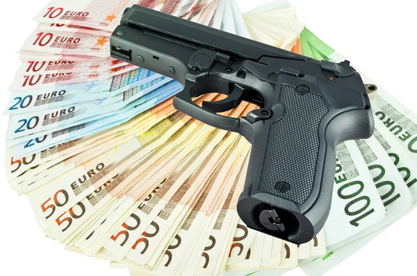 Arma e dinheiro — Fotografia de Stock