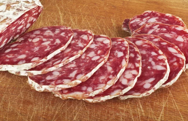 Salami with slices — Stock Photo, Image