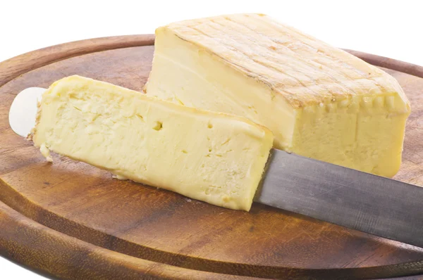 Taleggio cheese cut on knife — Stock Photo, Image