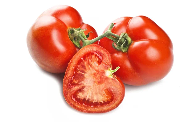 Kolme punaista tomaattia — kuvapankkivalokuva