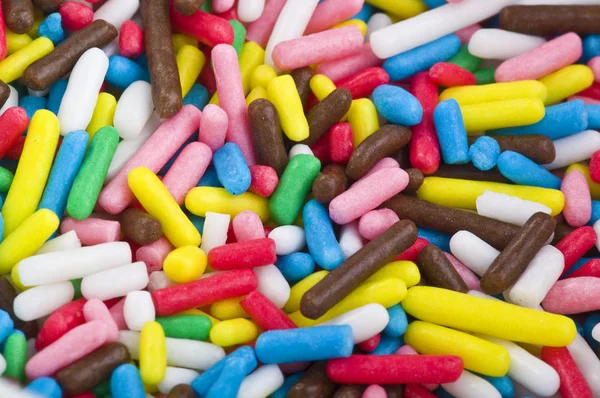 Doces coloridos - grãos de açúcar colorido — Fotografia de Stock