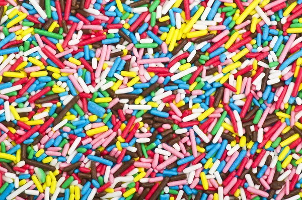 Colored candies - grains of colored sugar — Stock Photo, Image