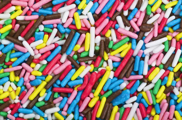 Кольорові цукерки - зерна кольорового цукру — стокове фото