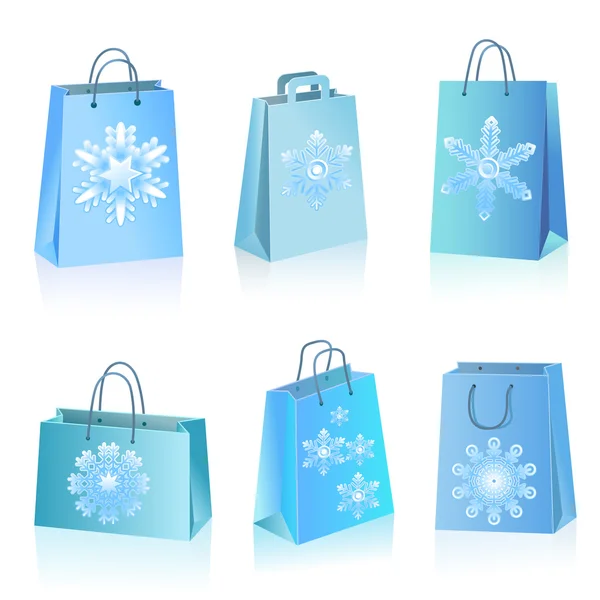 Sacos de papel azul com ícone de flocos de neve — Vetor de Stock