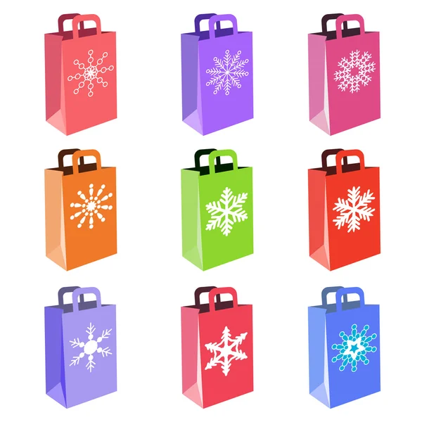 Sacos de compras com símbolos de floco de neve — Vetor de Stock