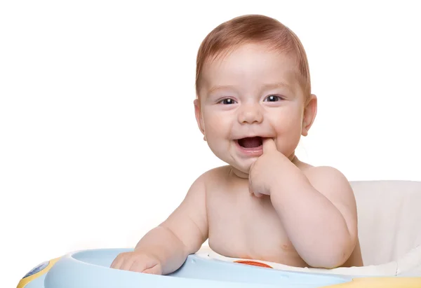 stock image Child sitting in baby chair and smile.