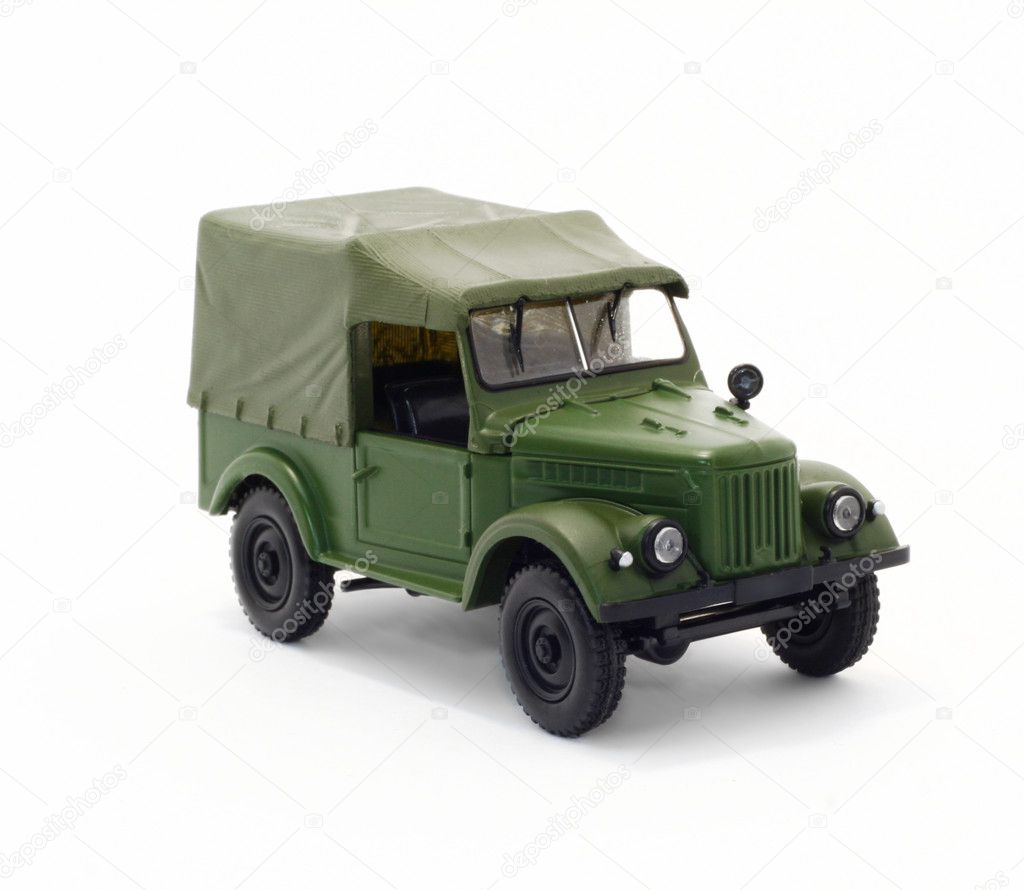 Green military car isolated on a white background