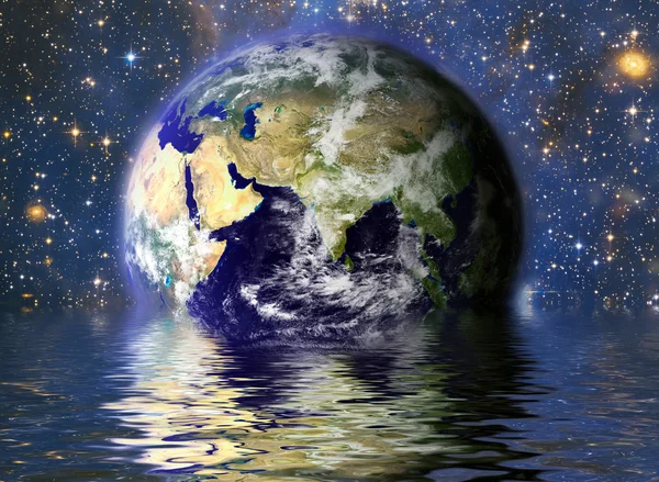 Planeet aarde in het water Stockfoto
