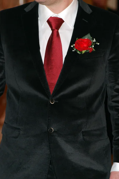 stock image Groom suit with red rose