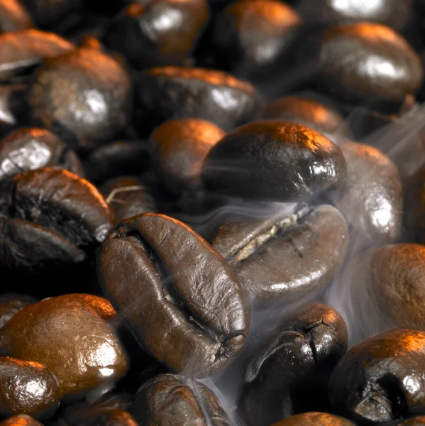 Smoky coffee beans — Stock Photo, Image