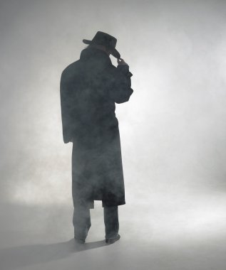 Woman wearing trench coat and standing in fog clipart