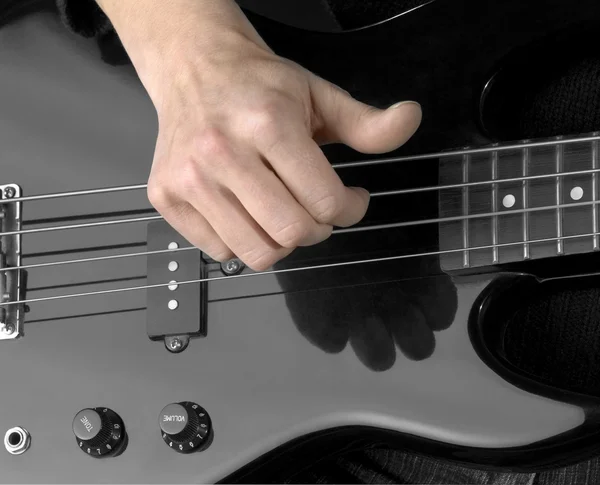 Hand and electric bass — Stock Photo, Image