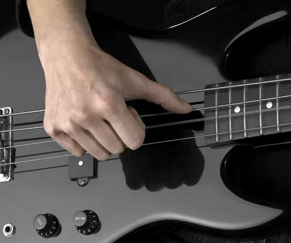 stock image Hand on bass guitar