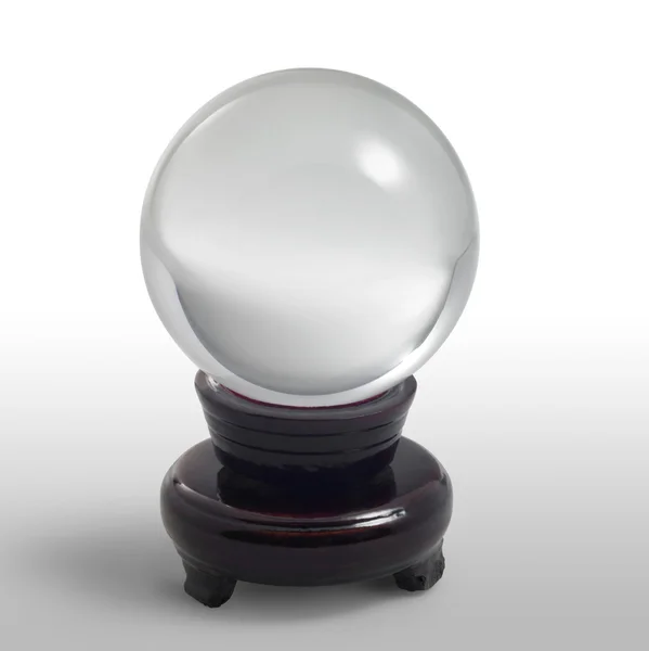 Crystal ball on stand in light back — Stock Photo, Image