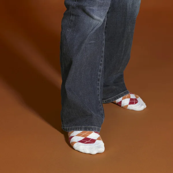 Standing feet in brown back — Stock Photo, Image