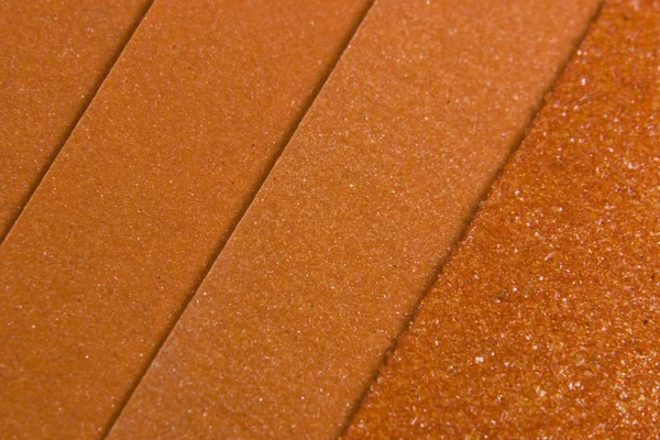 Orangefarbene Schleifpapier-Variationen — Stockfoto