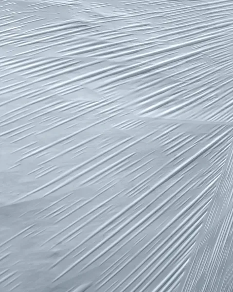 Detalhe de folha de plástico branco envolto — Fotografia de Stock