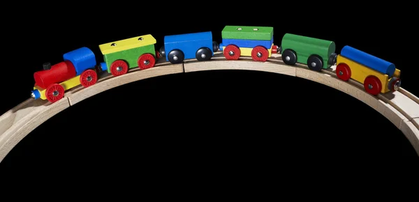 Деревянный игрушечный поезд на рельсах — стоковое фото