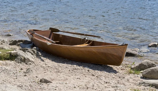 stock image Wooden rowboat waterside