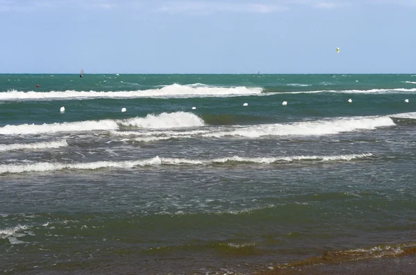 stock image Surfers on green sea in Italy